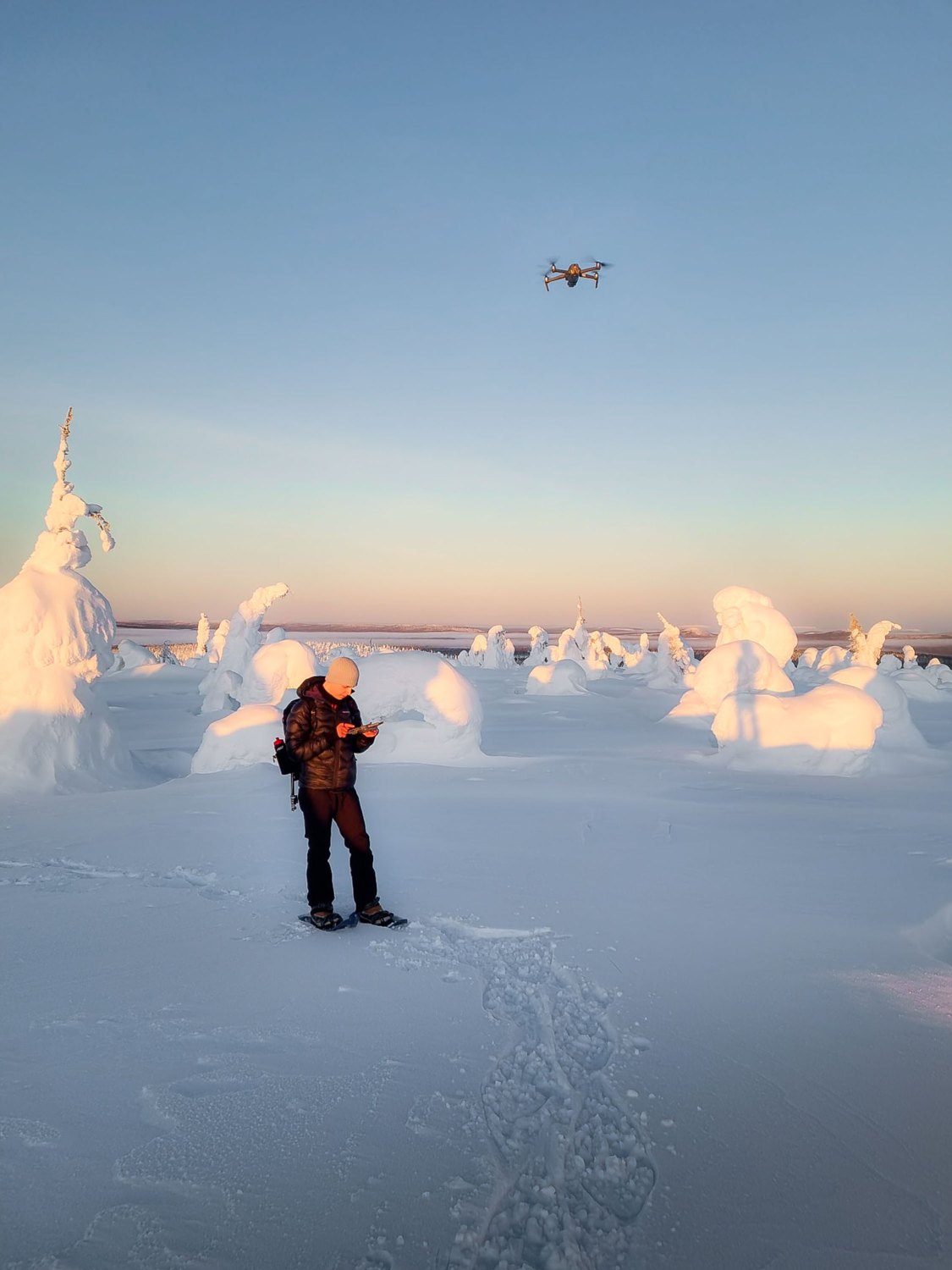 Hugo shooting in the Finnish winter – flying a drone over snow-laden trees at golden hour